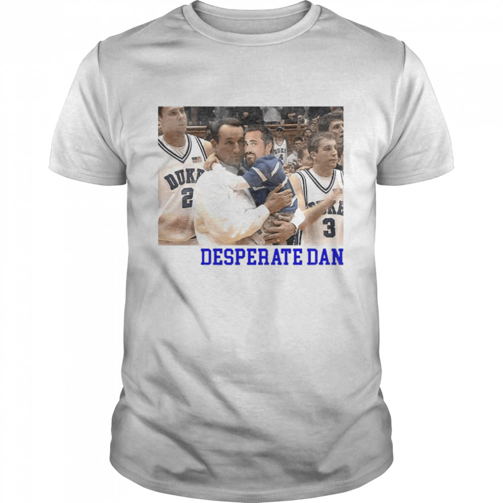 Coach K holding BigCat desperate Dan shirt